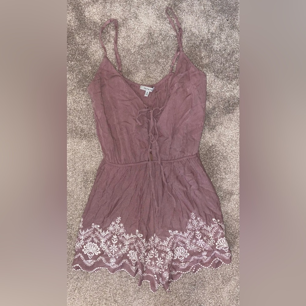 Blush romper with floral trim